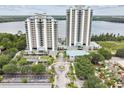 Expansive aerial view showcasing the condo buildings, lake, and amenities, highlighting the community's premium location at 13427 Blue Heron Beach Dr # 404, Orlando, FL 32821
