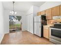 Eat-in kitchen featuring stainless steel appliances and a sliding door to the backyard at 1447 Candlewyck Dr, Orlando, FL 32807