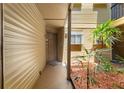 Private condo entrance featuring neutral colors and a decorative mulch bed at 1908 Lake Atriums Cir # 3, Orlando, FL 32839