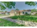 Charming single-story home featuring an attached two-car garage and neutral stucco exterior at 324 Sir Lawrence Dr, Sanford, FL 32773