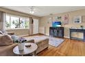 Comfortable living room with hardwood floors, a ceiling fan, and ample natural light at 4015 Ibis Dr, Orlando, FL 32803