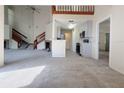 Open floorplan with carpet flooring, fireplace, stairs, and renovated kitchen at 947 Bird Bay Ct # 205, Lake Mary, FL 32746