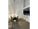 Open concept dining area with modern table, pendant light, and seating for six guests at 970 N Spring Garden Ave # 621, Deland, FL 32720