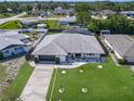 Beautiful home with screened in porch area, well maintained lawn, and privacy fence at 1129 Madura Dr, Deltona, FL 32725