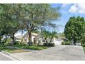Lovely home with a long driveway, mature landscaping and side-entry garage at 2674 Spicebush Loop, Apopka, FL 32712