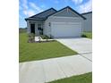 Charming single-Gathering home showcasing a well-kept lawn and attached two-car garage at 2707 Virginia Pine Nw Dr, Bartow, FL 33830