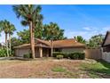 Cozy single-Gathering home with a garage, front yard, and mature trees offering shade at 2715 Wekiva Meadows Ct, Apopka, FL 32712