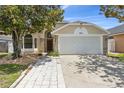 Charming one story home with a two car garage and beautiful mature trees at 2933 Birmingham Blvd, Orlando, FL 32829
