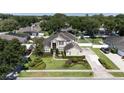 Beautifully landscaped home with manicured lawns, fountain, and mature trees in a lovely neighborhood at 325 Green Ash Ln, Sanford, FL 32771