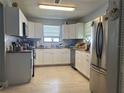 Bright kitchen featuring white cabinets, stainless steel appliances, butcher block countertop at 400 Palm Ave, Ormond Beach, FL 32174