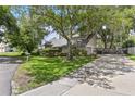 Lovely home with a well-kept lawn and shade trees highlighting the property's curb appeal at 4030 Cool Water Ct, Winter Park, FL 32792