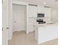 Bright kitchen featuring an island and stainless steel appliances, perfect for cooking at 4325 Switchgrass Ln, St Cloud, FL 34772
