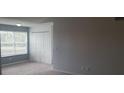 Cozy bedroom features a closet, large window for natural light, and plush carpeting for added comfort at 5160 Conroy Rd # 1437, Orlando, FL 32811