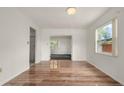 Bright dining room with light hardwood floors, white walls, and a large window at 6416 Jackwood Ct, Orlando, FL 32818