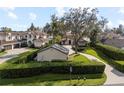 Stately home showcasing meticulous landscaping, mature oak trees, and a circular driveway at 11018 Lake Butler Blvd, Windermere, FL 34786