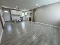 Spacious living room featuring modern gray flooring and freshly painted walls awaiting new decor at 1139 Poppy Ave, Orlando, FL 32811