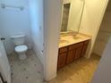 Well-lit bathroom with double sinks and ample counter space at 2018 Cypress Bay Blvd, Kissimmee, FL 34743