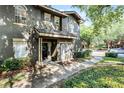Two-story townhouse with a covered front porch and landscaped yard at 209 Villa Di Este Ter # 205, Lake Mary, FL 32746
