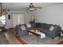 Inviting living room with a neutral palette, stylish sectional sofa, and decorative accents at 26586 Se Highway 42, Umatilla, FL 32784