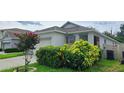 Well-maintained single Gathering home featuring a two-car garage and mature landscaping at 3202 Timber Hawk Cir, Ocoee, FL 34761