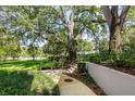 Beautifully landscaped grounds with seating and walkways, perfect for relaxation at 700 Melrose Ave # C22, Winter Park, FL 32789