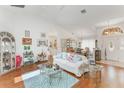 Bright living room with hardwood floors, archways, and natural light at 109 Hunter Point Ct, Debary, FL 32713