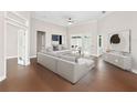 Bright, neutral living room with ample seating, stylish decor, and sliding doors at 19562 Majestic St, Orlando, FL 32833