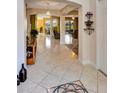 Spacious foyer with tile floors and arches leading to the living spaces of the home at 2631 Captains Ct, Kissimmee, FL 34746