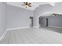 Spacious living room with tiled floors, high ceilings, and neutral paint, creating an airy atmosphere at 300 Florida Pkwy, Kissimmee, FL 34743