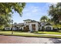 Beautiful view of a two story house with manicured front yard at 3428 Chaine Du Lac Blvd, Windermere, FL 34786