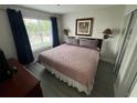 This is a light filled main bedroom with a view of the community at 6337 Parc Corniche Dr # 2311, Orlando, FL 32821