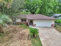 Charming single-story home featuring a brick and siding exterior, well-maintained lawn and a two-car garage at 6421 Nw 61St St, Ocala, FL 34482