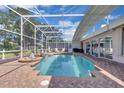 Screened-in pool area features a relaxing hot tub and ample space for entertaining at 736 Timacuan Blvd, Lake Mary, FL 32746