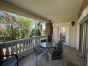 Inviting balcony with tile flooring and ample seating, perfect for enjoying the outdoor view at 7651 Whisper Way # 201, Kissimmee, FL 34747