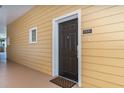 The condo entrance featuring a brown door with a window and unit number at 9051 Treasure Trove Ln # 505, Kissimmee, FL 34747