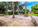 Relaxing lakeside yard with seating area and walkway to the main house at 1018 Turner Rd, Winter Park, FL 32789