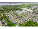 Breathtaking aerial view of a residential community with lakes, lush green spaces, and well-maintained homes at 1027 Eagle Tree Ln, Sanford, FL 32771