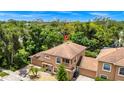 Beautiful home with mature trees and a well-kept yard, aerial view showing the Orlando skyline at 1046 Morris Ave # 1046, Orlando, FL 32803