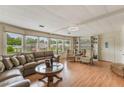 Bright and spacious living room with large windows and hardwood floors at 142 Florence Blvd, Debary, FL 32713