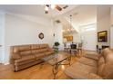 Inviting living room showcasing an open floor plan, hardwood floors, and comfortable seating, ideal for entertaining guests at 14224 Colonial Lakes Dr, Orlando, FL 32826