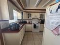 Functional kitchen featuring white appliances and ample counter space at 1812 Firwood Ct, Orlando, FL 32818