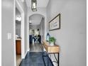 Inviting foyer with wood-look floors and stylish console table at 3214 Calabria Avenue, Davenport, FL 33897