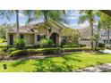 Beautiful home with an arched entry, well-maintained lawn, manicured landscaping, and two car garage at 3307 Kentshire Blvd, Ocoee, FL 34761