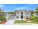 Stunning home with a well-manicured lawn and beautiful curb appeal at 3824 Blue Dasher Dr, Kissimmee, FL 34744
