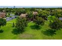 Lush green lawn surrounding condos in park-like setting, with parking and mature trees at 420 Forestway Cir # 206, Altamonte Springs, FL 32701