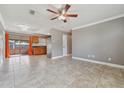 Expansive living room featuring tile flooring, a ceiling fan, and plenty of natural light at 510 Peach Tree Ln, Altamonte Springs, FL 32701