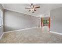 Bright living room showcasing tile floors, neutral paint, and sliding glass doors to the outdoors at 510 Peach Tree Ln, Altamonte Springs, FL 32701