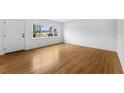 Bright living room with hardwood floors and large windows at 714 28Th St, Orlando, FL 32805