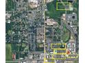 An aerial view shows the proximity to local stores and restaurants in a convenient location at 879 City Walk Ln, Oviedo, FL 32765
