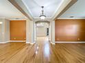 Spacious living room with hardwood floors and neutral paint, perfect for entertaining at 13055 Overstreet Rd, Windermere, FL 34786